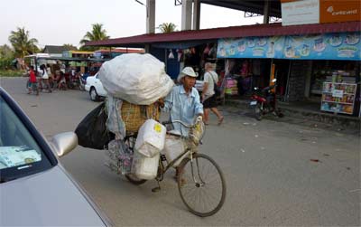 Hauling goods to the SihanoukVille Central Market on a bicycle